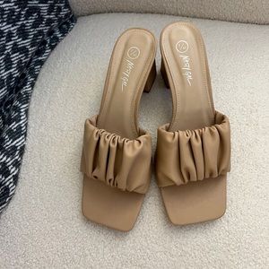 Lightly worn nude heeled sandals